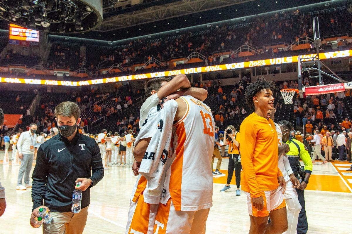 Santiago Vescovi (25) embraces Olivier Nkamhoua (13) after defeating Ole Miss in the SEC home opener in Thompson Boling Arena on Wednesday Jan. 6, 2022.
