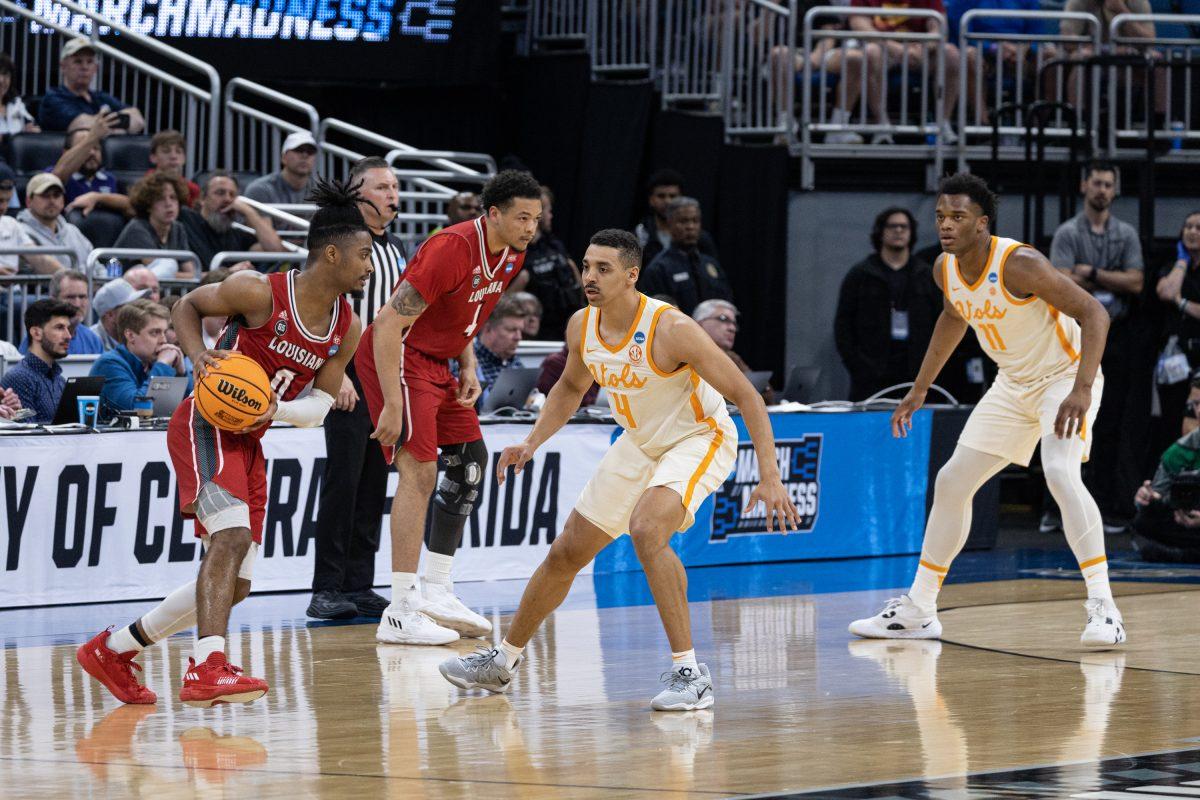 University of Tennessee Volunteers basketball player Tyreke Key (4), center, and his teammate Tobe Awaka (11) guard their opponents during a NCAA tournament game against the University Of Louisiana Ragin’ Cajuns at Amway Center, Orlando, Florida, Mar. 16, 2023.