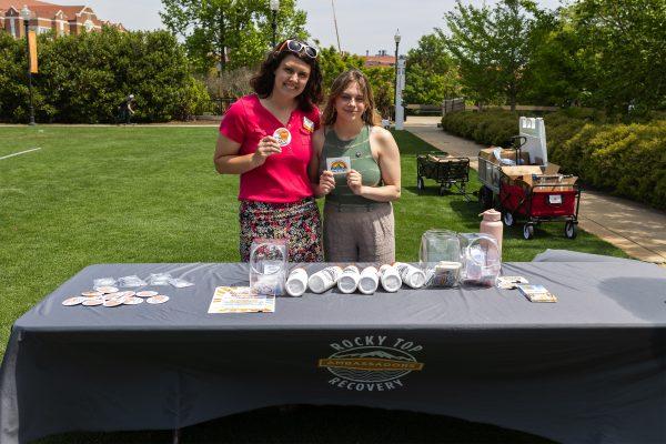 Jenna Spurlock, a grad assistant with the Center for health Education &amp; Wellness (left), Grace Hardin, a Rocky Top Recovery Ambassador provide information to students about recovery at the Play it Safe Picnic at the HSS Lawn. Thursday April 20, 2023.