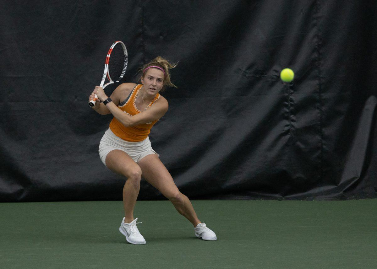 University of Tennessee Lady Volunteers tennis player Rebeka Mertena strokes the ball during a match against the University Of Alabama Crimson Tide at Goodfriend Tennis Center, March 19, 2023.
