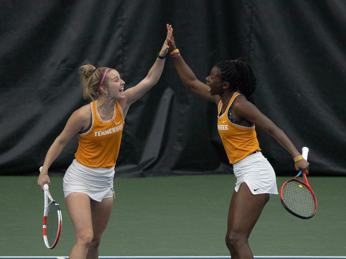Lady Vol tennis players Rebeka Mertena, left, and Esther Adeshina celebrate following a win in a doubles match against the Alabama at Goodfriend Tennis Center, March 19, 2023.