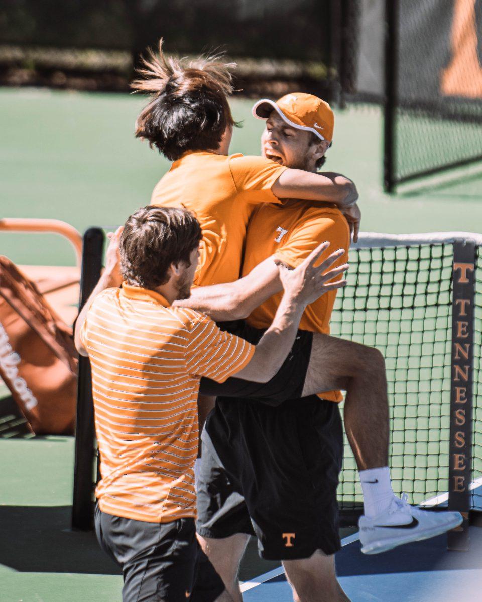 Tennessee men's tennis celebrates Emile Hudd's clinching win over #2 Kentucky on April 2, 2023.