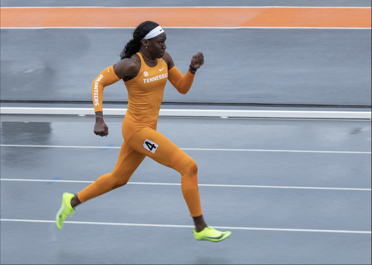 Charisma Taylor (4) sprints down the track as part of a 100 meter hurdle race during a meet at Tom Black Track at LaPorte Stadium, April 8, 2023.