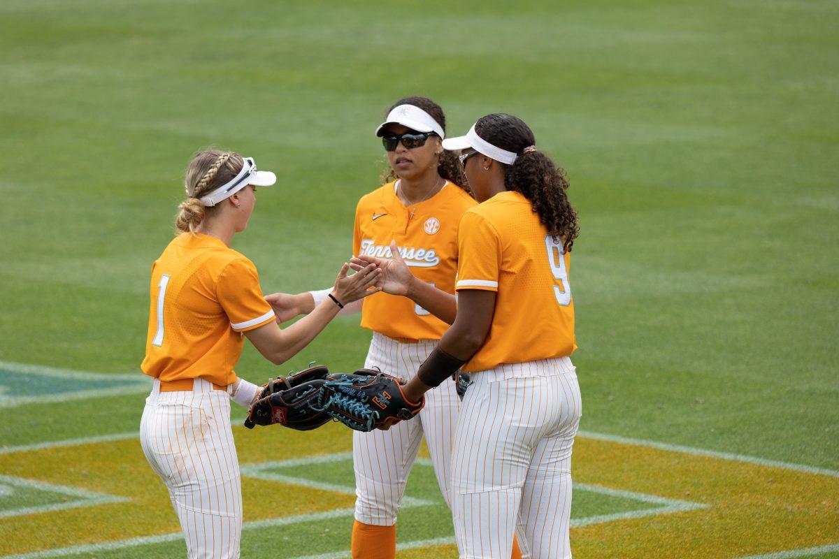 Katie Taylor (1), Rylie West (5) and Kiki Milloy (9) gather in the outfield during a timeout against South Carolina at Sherri Parker Lee Stadium. Sunday May 7, 2023.