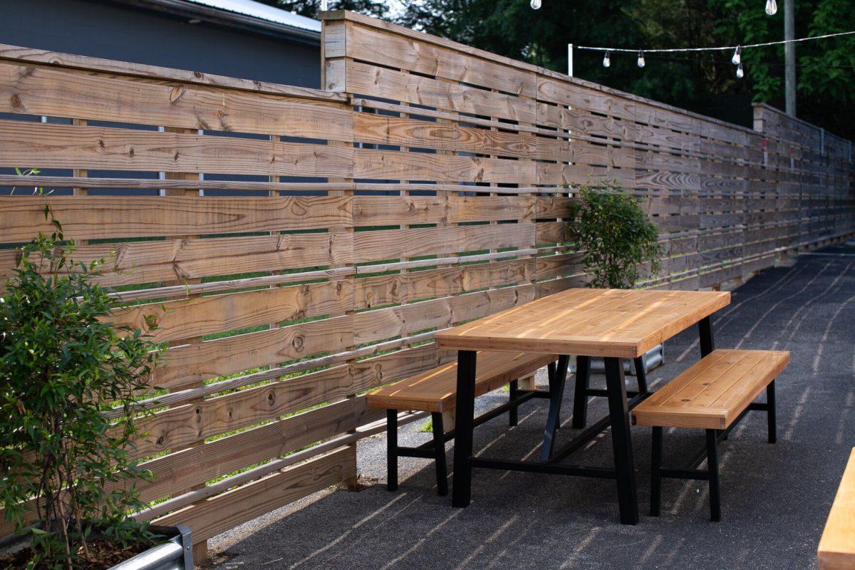 Sutherland Avenue's Seed Coffee Co. boasts a spacious outdoor seating area complete with picnic tables and soft string lighting.