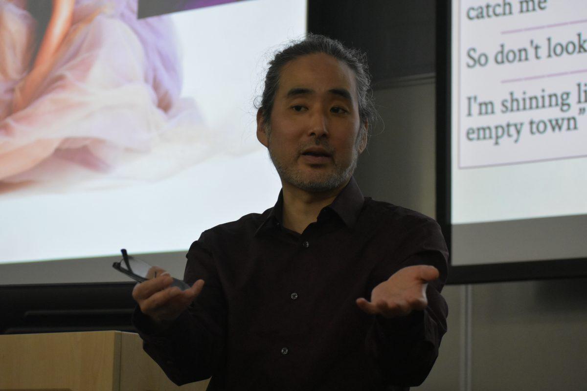 English lecturer John Han, faculty leader and creator of the Taylor Swift Literary Club, leads the analysis of Swift's discography at the club's inaugural meeting.