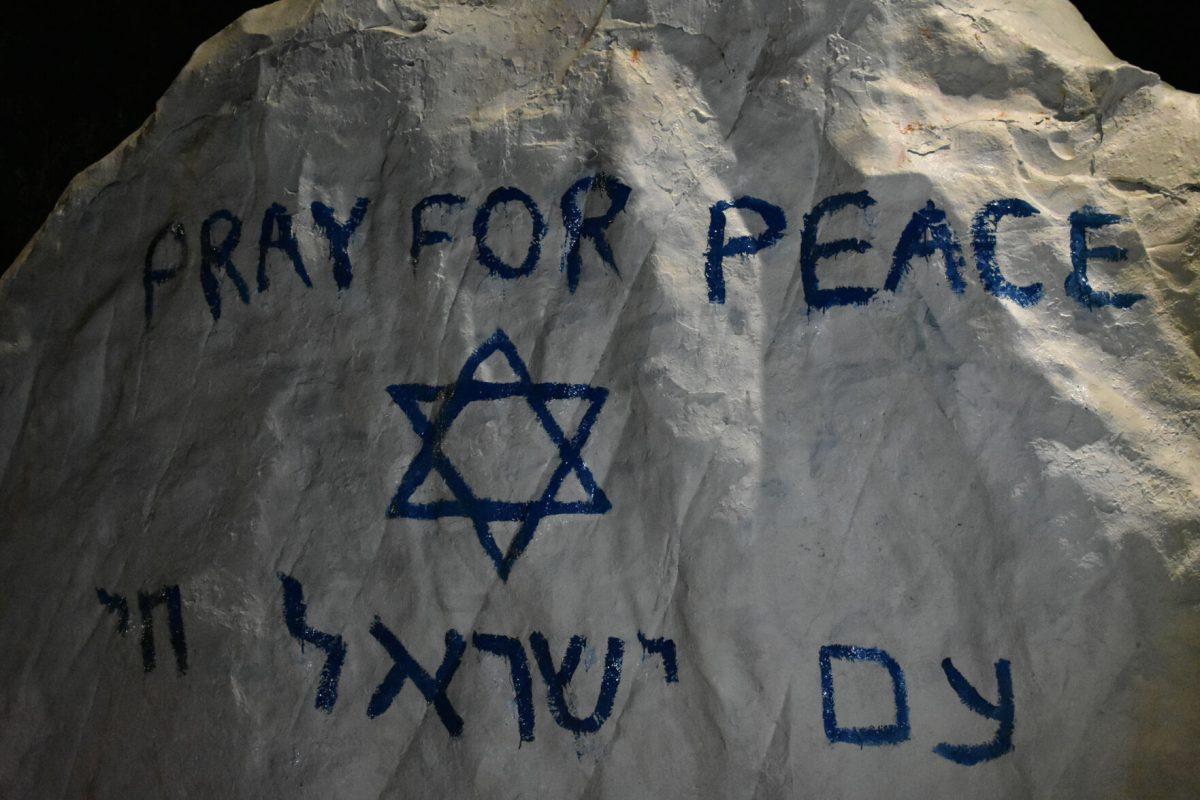 Students paint the Rock in remembrance of the lives lost in the Hamas attack in Israel. Thursday, Oct. 12, 2023.