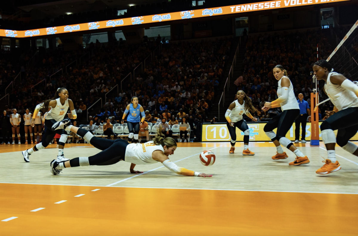 Caroline Kerr (11) digs the ball to keep the Lady Vols alive early in the first set. Sunday, Oct. 15, 2023.