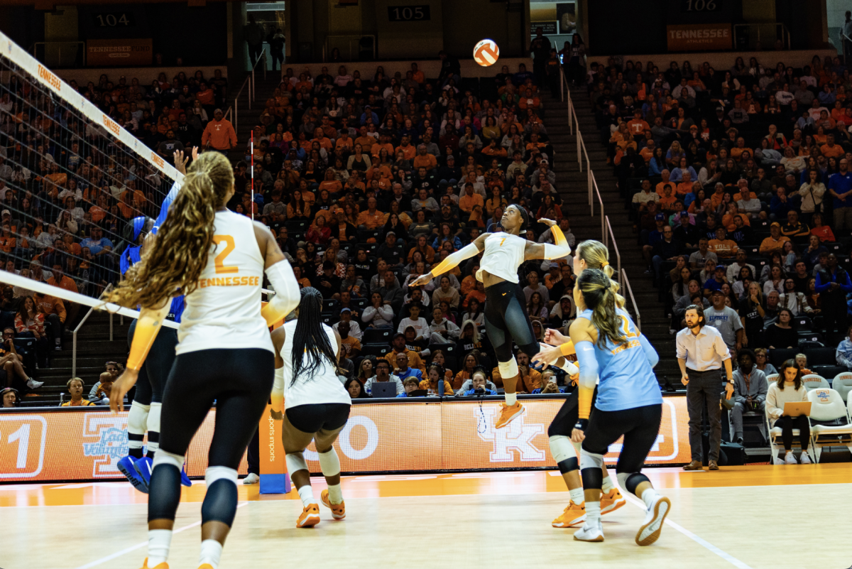 Right-side hitter Morgahn Fingall (7) jumps up to spike the ball over Kentucky defenders. Sunday, Oct. 15, 2023.