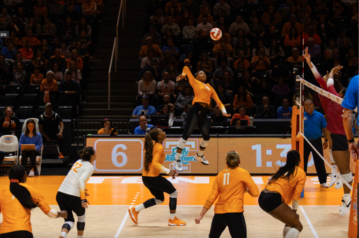 Outside hitter Jenaisya Moore (18) goes up for a spike against Arkansas in the first set. Friday, Oct. 20, 2023.