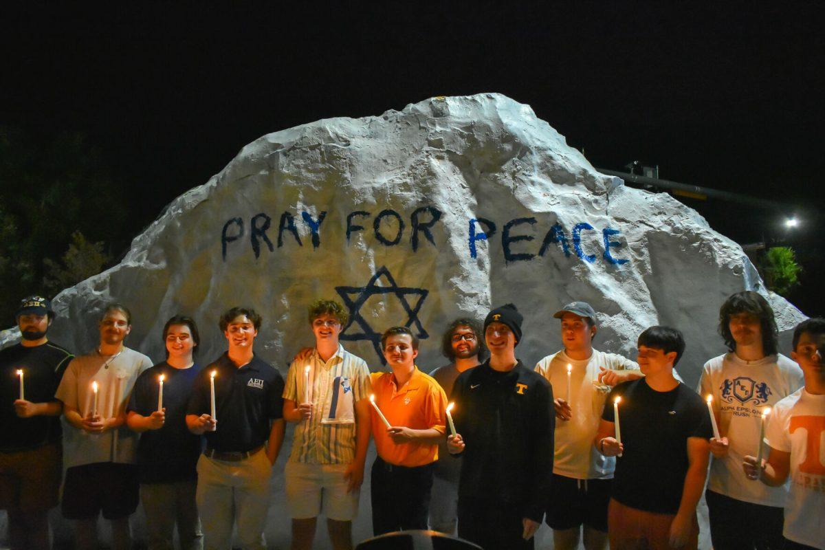 Members of the Jewish fraternity, Alpha Epsilon Pi, pose in front of the Rock. Thursday, Oct. 12, 2023.