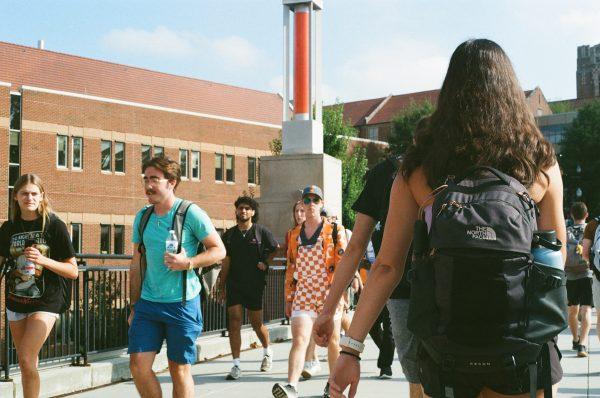 Students walk on Ped Walkway at UT, a university that is seeing record application numbers.