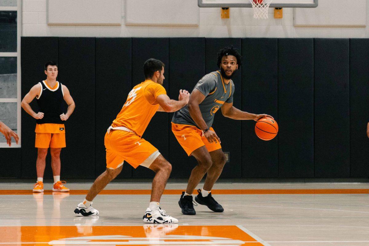 Josiah-Jordan James (30) is guarded by Santiago Vescovi (25) in practice. Thursday, Nov. 2, 2023.