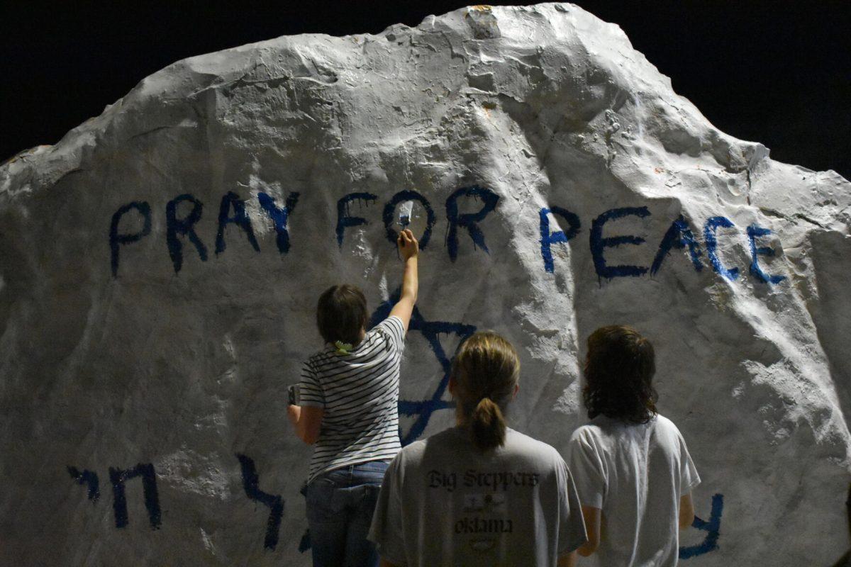 Students paint the Rock in memoriam of those who were killed in the Oct. 7 Hamas attack. Oct. 12, 2023.