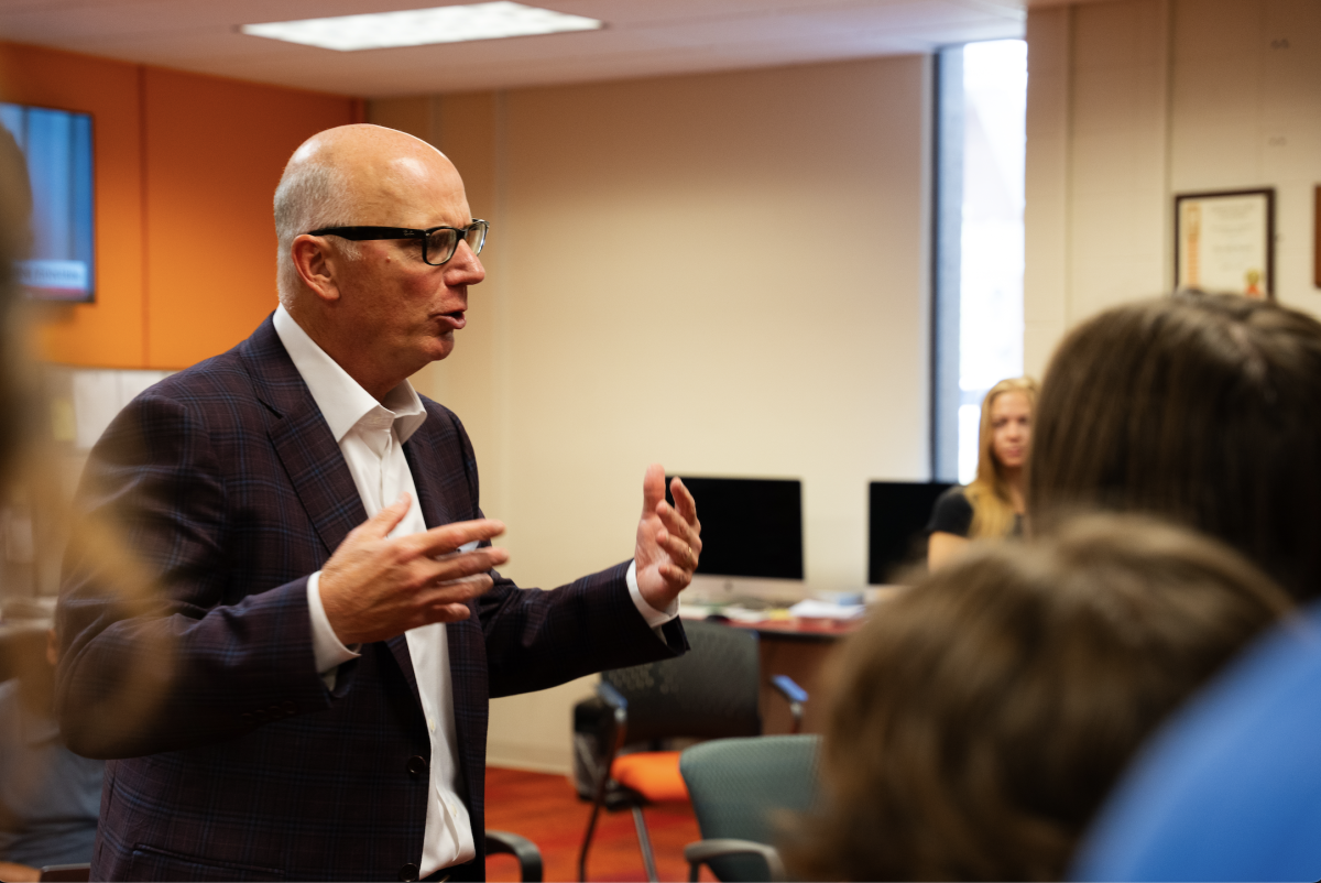Gene Wojciechowski ('79), who is set to join the College of Communication and Information as a professor of practice, speaks with students during a recent visit to The Daily Beacon office.