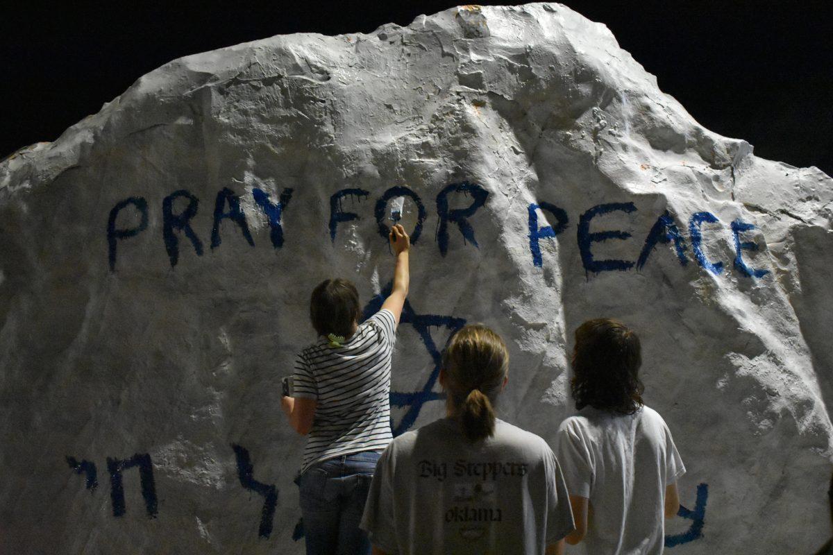 Students paint the Rock in memoriam of those who were killed in the Oct. 7 Hamas attack. Oct. 12, 2023.