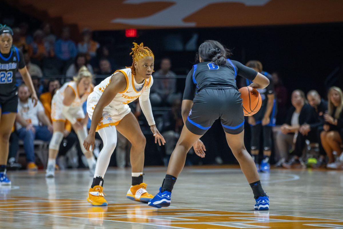 Jasmine Powell (15) defends her opponent during a game against the University of Memphis at Food City Center. Monday, Nov. 13, 2023.