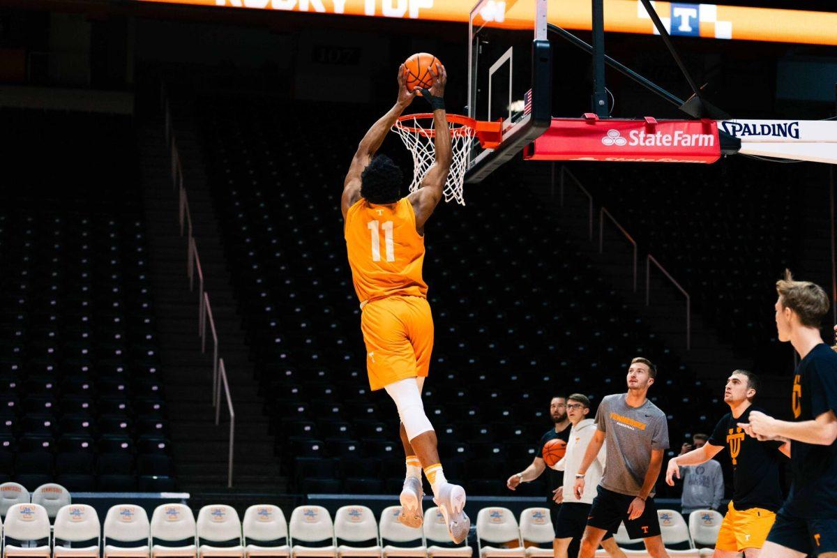 Tobe Awaka (11) dunks ball at practice at the Food City Center. Thursday, Oct 26, 2023.