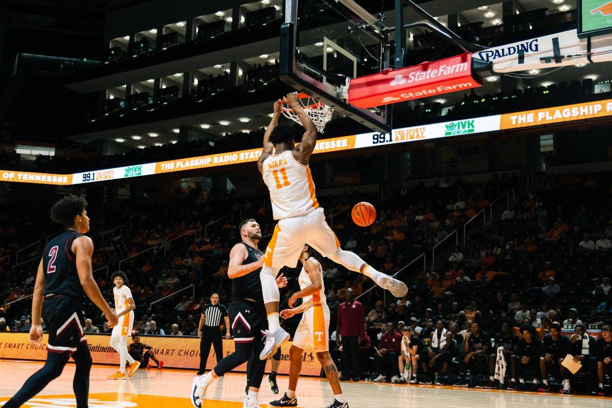 Tobe Awaka (11) dunks on a Lenoir-Rhyne defender in the Food City Center. Tuesday, Oct 31, 2023. (Parker Phegley)