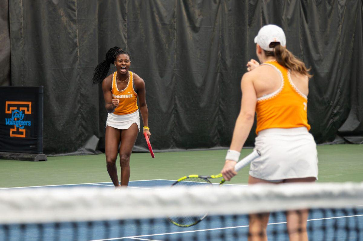 Esther Adeshina celebrates with Alana Wolfberg as they win a point against Vanderbilt at Goodfriend Tennis Center. Friday, Jan. 26, 2024.