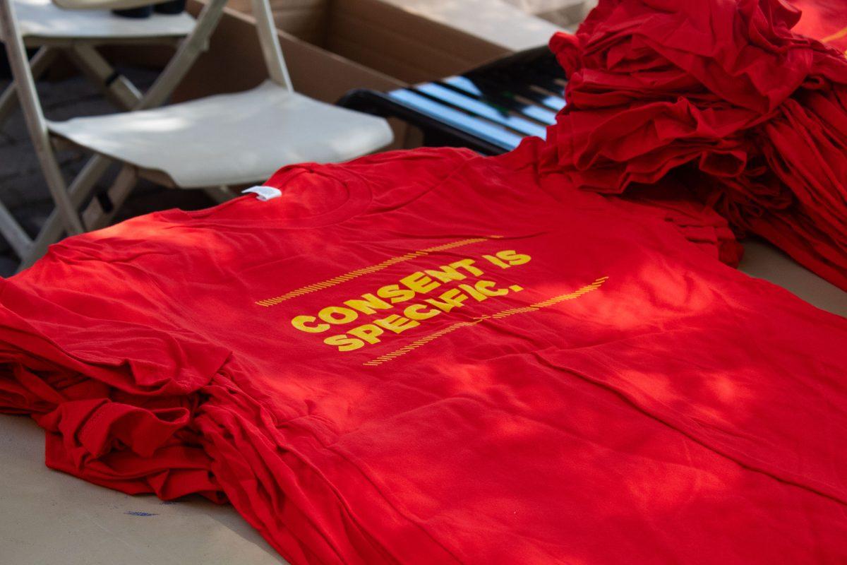 A pile of "CONSENT IS SPECIFIC" t-shirts sit ready to be given to students as a part of CHEW's T-shirt Tuesdays. 