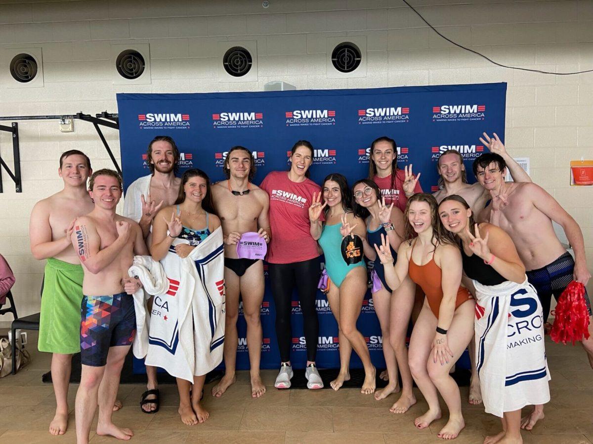 Vols Swim Club poses with world record holder and Olympic gold-medalist Missy Franklin, who has been a big supporter of Swim Across America for many years.