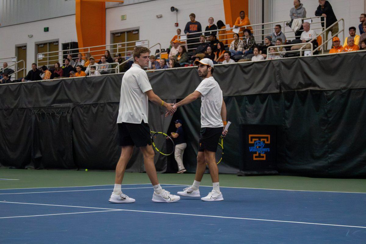 Johannus Monday and Angel Diaz celebrate after a volley during a match against Georgia at Goodfriend Tennis Center. Friday, March 1, 2024