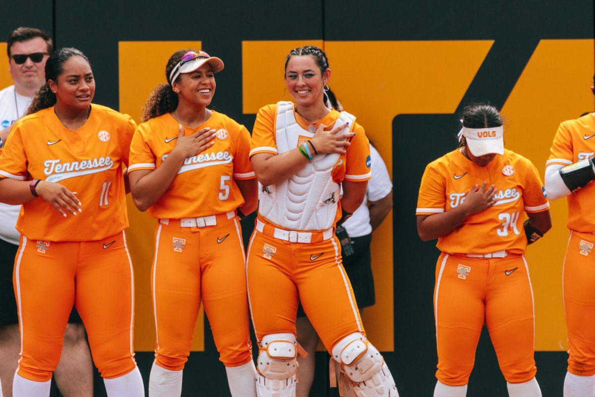 Rylie West (5) and Sophia Nugent (7) laugh before a game against Alabama at Sherri Parker Lee Stadium. Friday, May 24, 2024.
