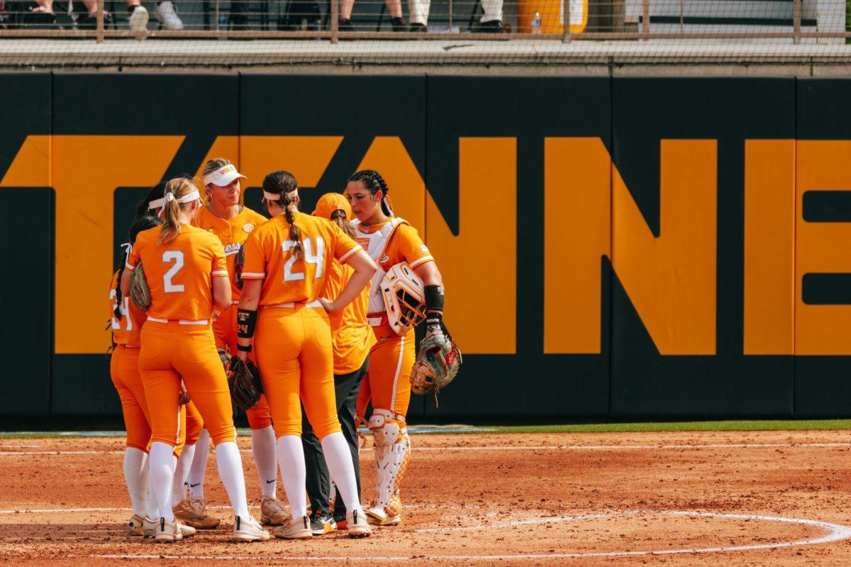 Lady Vols infield meet during a game against Alabama at Sherri Parker Lee Stadium. Friday, May 24, 2024.