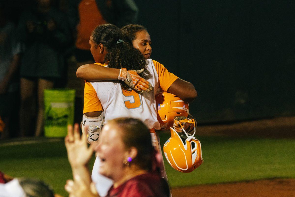 Kiki Milloy (9) and Rylie West (5) embrace after a game against Alabama at Sherri Parker Lee Stadium. Sunday, May 26, 2024.