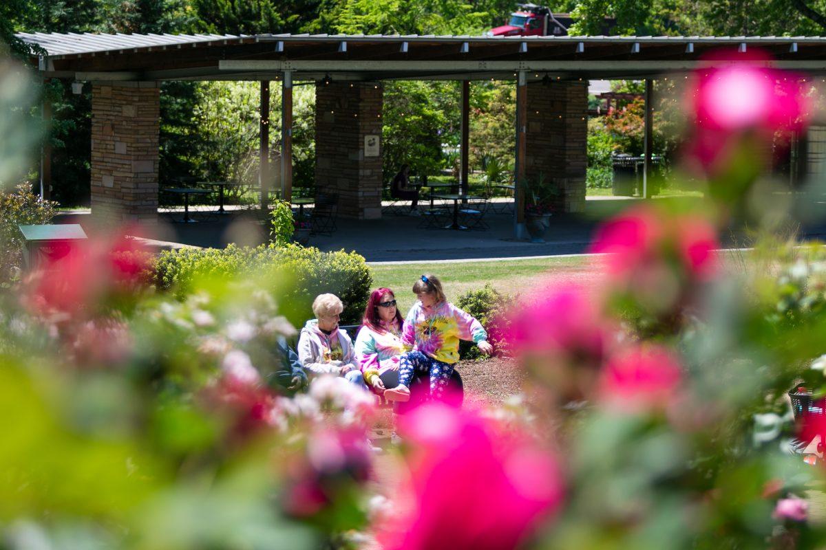 A family chats at the UT Botanical Gardens. Monday, April 22, 2024. 