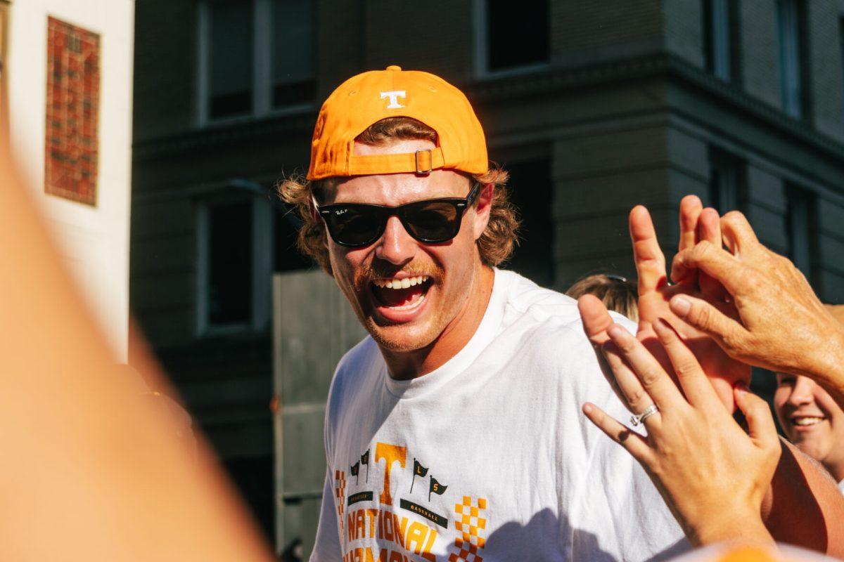 Austin Hunley (31) celebrates with Volunteer fans during the National Champion Volunteers parade. Tuesday, June 25, 2024.