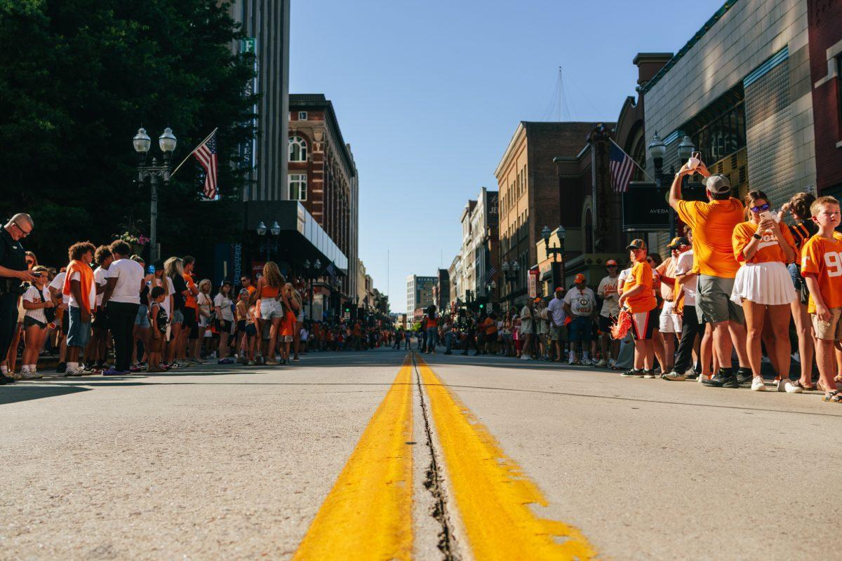 Volunteer Fans line the sides of South Gay Street before the National Champion Volunteers parade. Tuesday, June 25, 2024. 