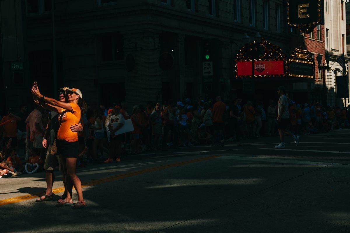 Volunteer Fans take a selfie before the National Champion Volunteers parade. Tuesday, June 25, 2024.