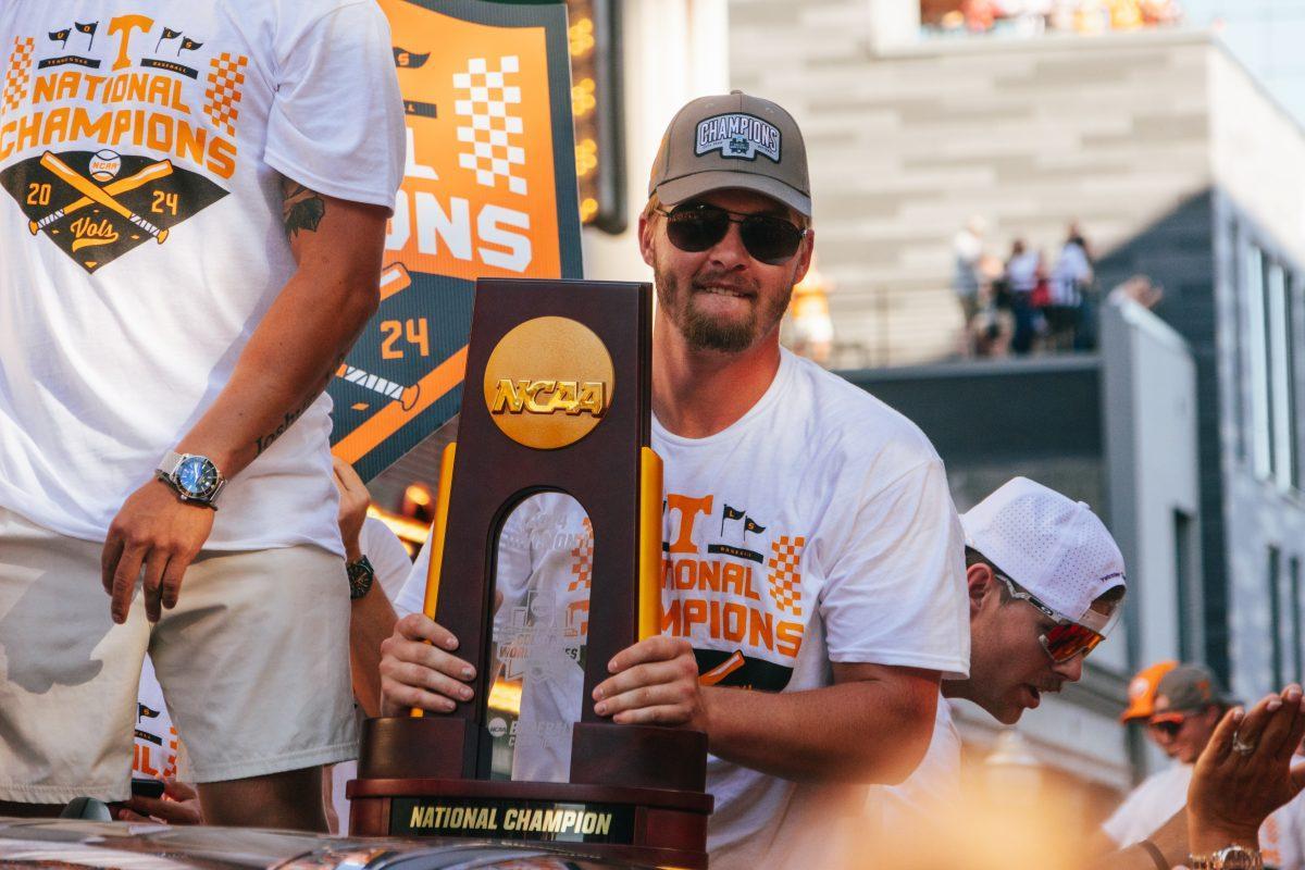 Blake Burke (25) celebrates during the National Champion Volunteers parade. Tuesday, June 25, 2024. 