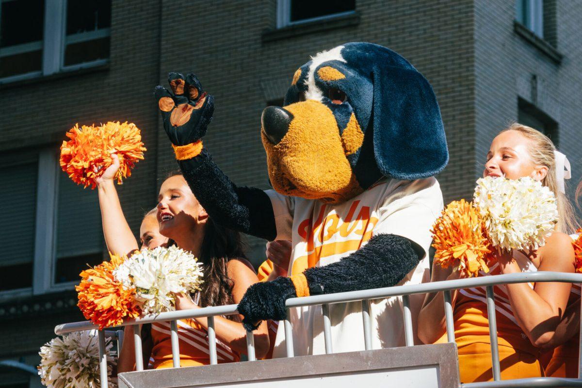 Smokey waves to Volunteer Fan during the National Champion Volunteers parade. Tuesday, June 25, 2024.