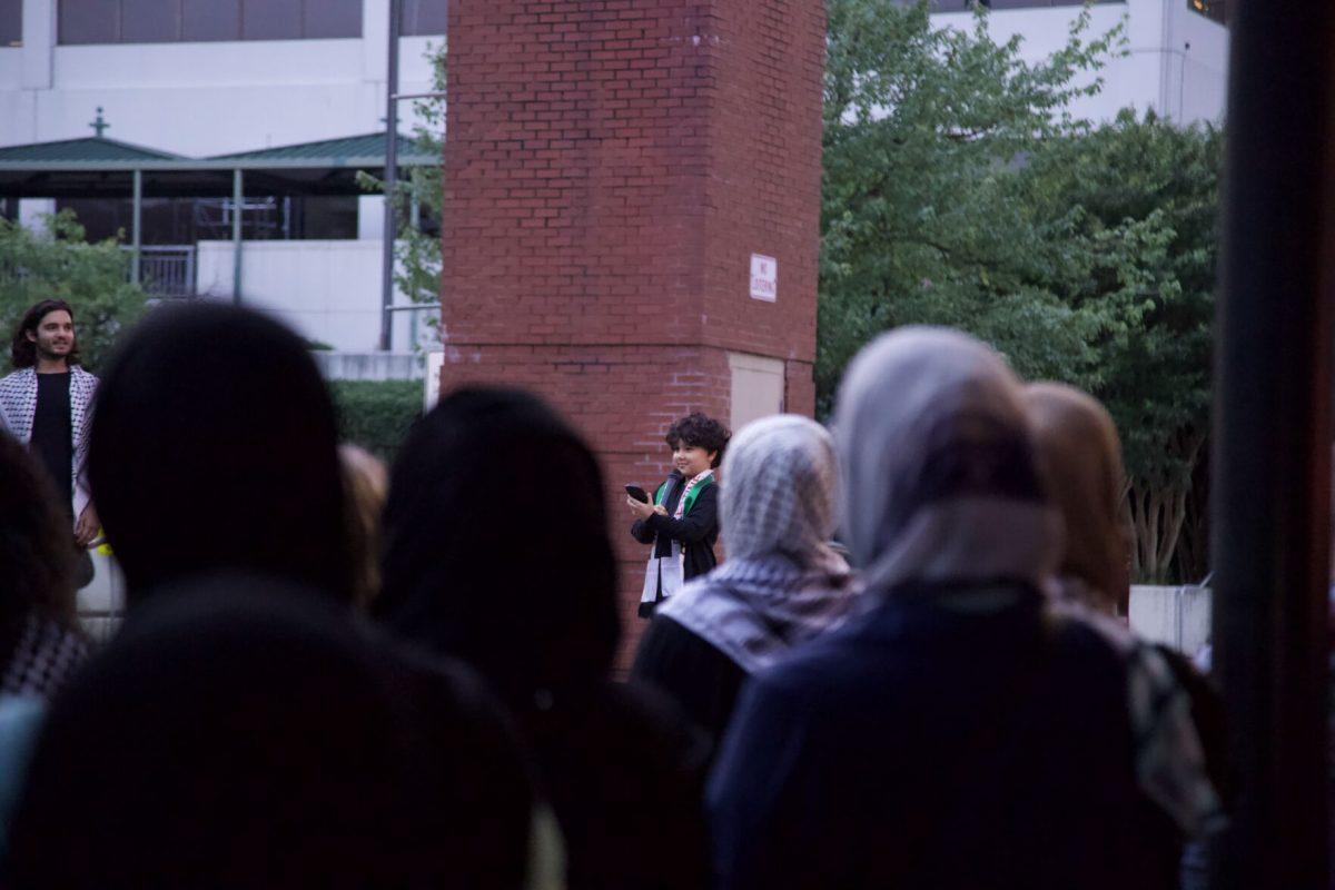 A little boy shares a poem about Palestine at the Naska Day vigil in Market Square. June 5, 2024. 