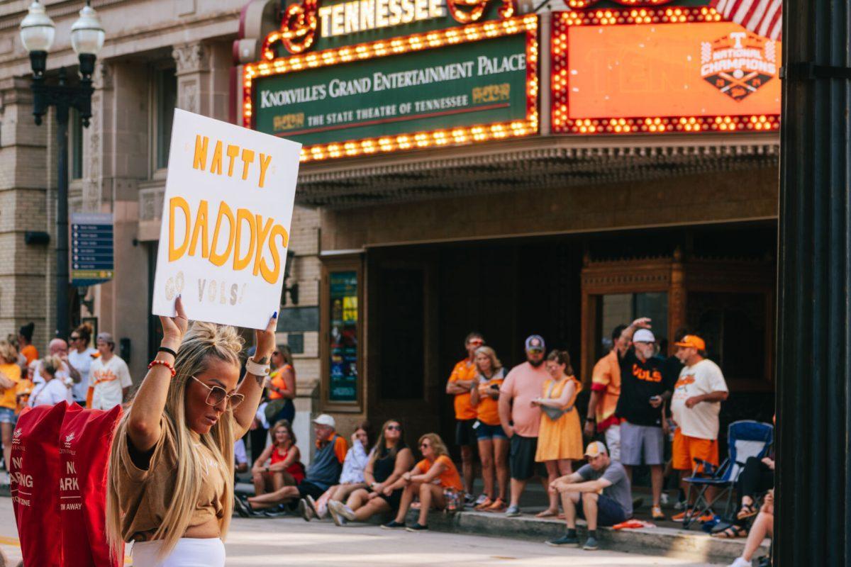 Volunteer Fan holds a sign in preperation for the National Champion Volunteers parade. Tuesday, June 25, 2024.