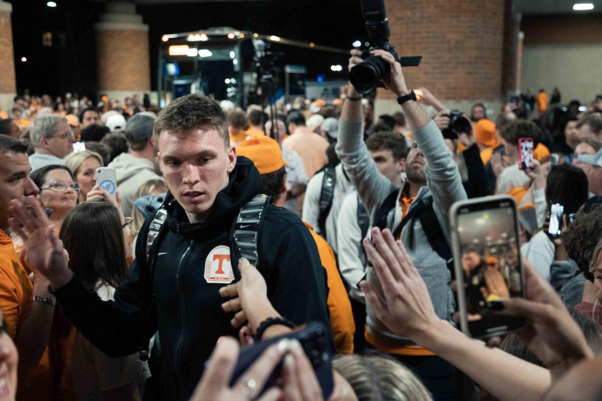 Dalton Knecht high-fives fans after Elite Eight loss to Purdue at Pratt Pavilion. Sunday, March 31, 2024.