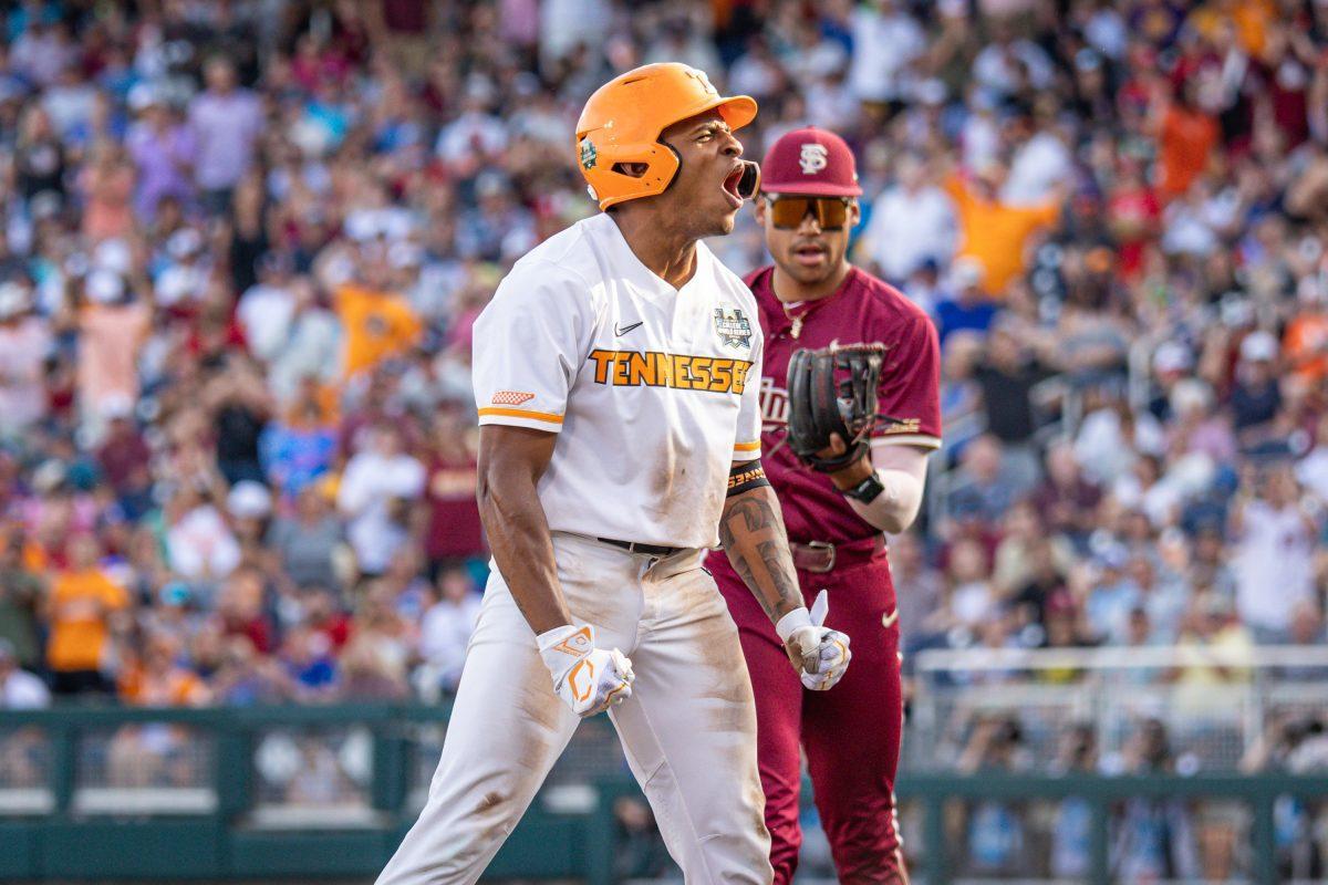 Christian Moore (1) celebrates an RBI hit during a College World Series game against Florida State at Charles Schwab Field. Friday, June 14, 2024.