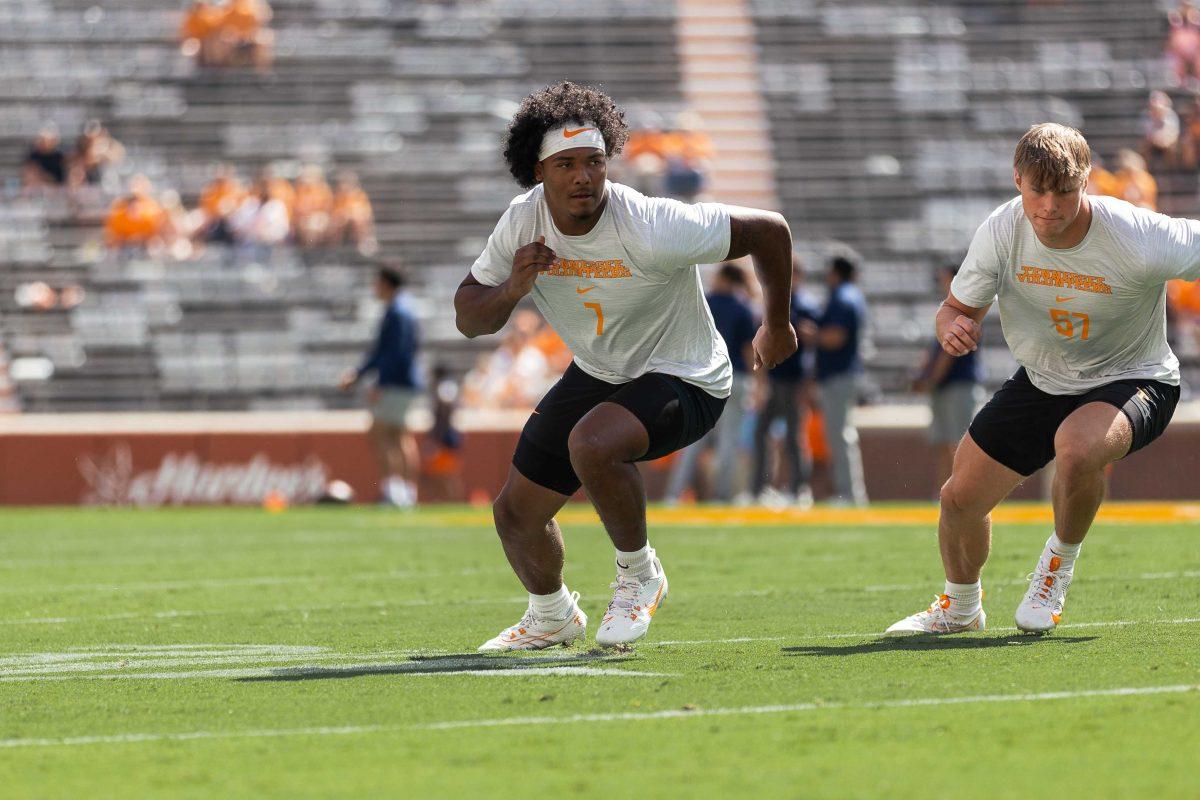 Arion Carter (7) and Ben Bolton (57) warm up ahead of Tennessee's matchup with UTSA in Neyland Stadium. Saturday, Sept. 23, 2023. 