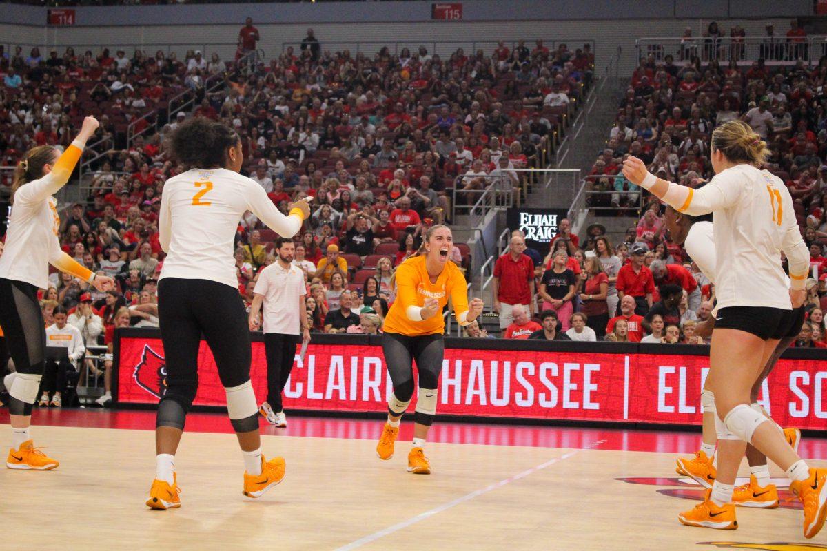 Vols cheer after winning a point during a match against Louisville at the KFC Yum! Center. Sunday, Sept. 1, 2024.