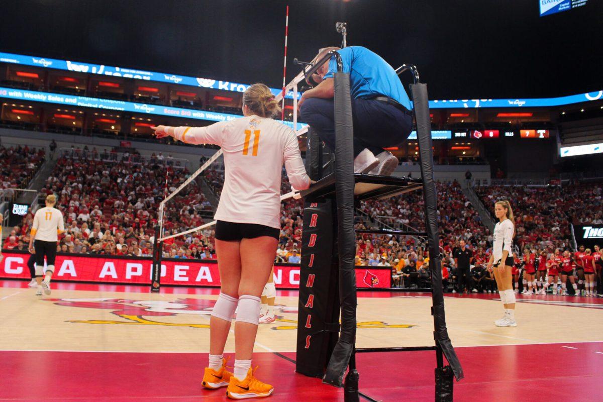 Caroline Kerr (11) disputes a call during a match against Louisville at the KFC Yum! Center. Sunday, Sept. 1, 2024.