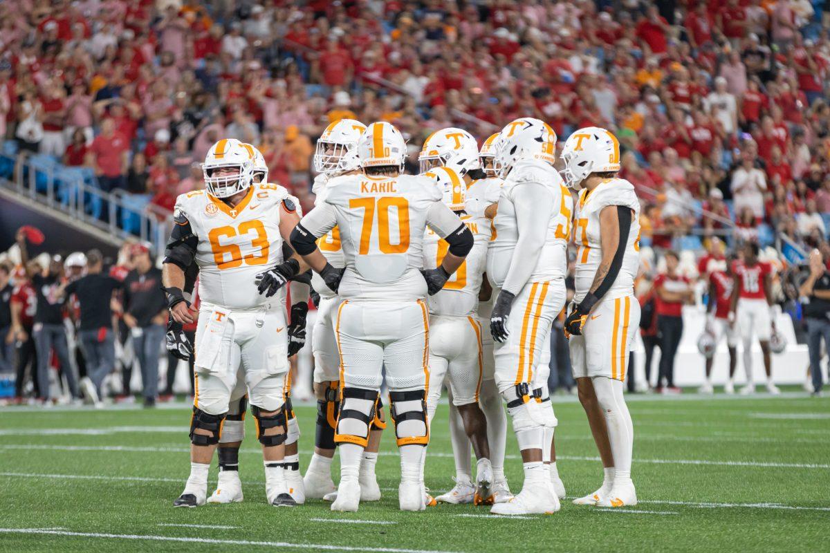 The Tennessee offense huddles during the Duke’s Mayo Classic against North Carolina State at Bank of America Stadium. Saturday, Sept. 7, 2024.
