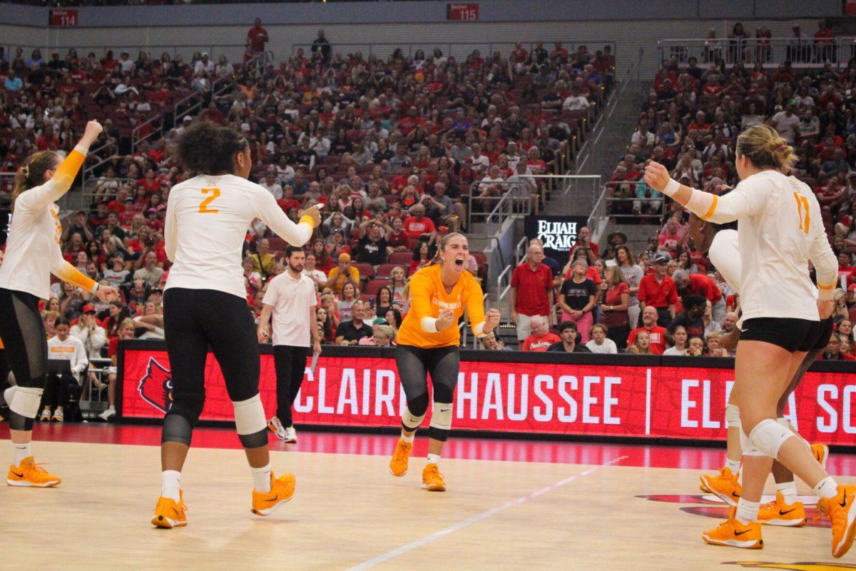 Vols cheer after winning a point during a match against Louisville at the KFC Yum! Center. Sunday, Sept. 1, 2024.