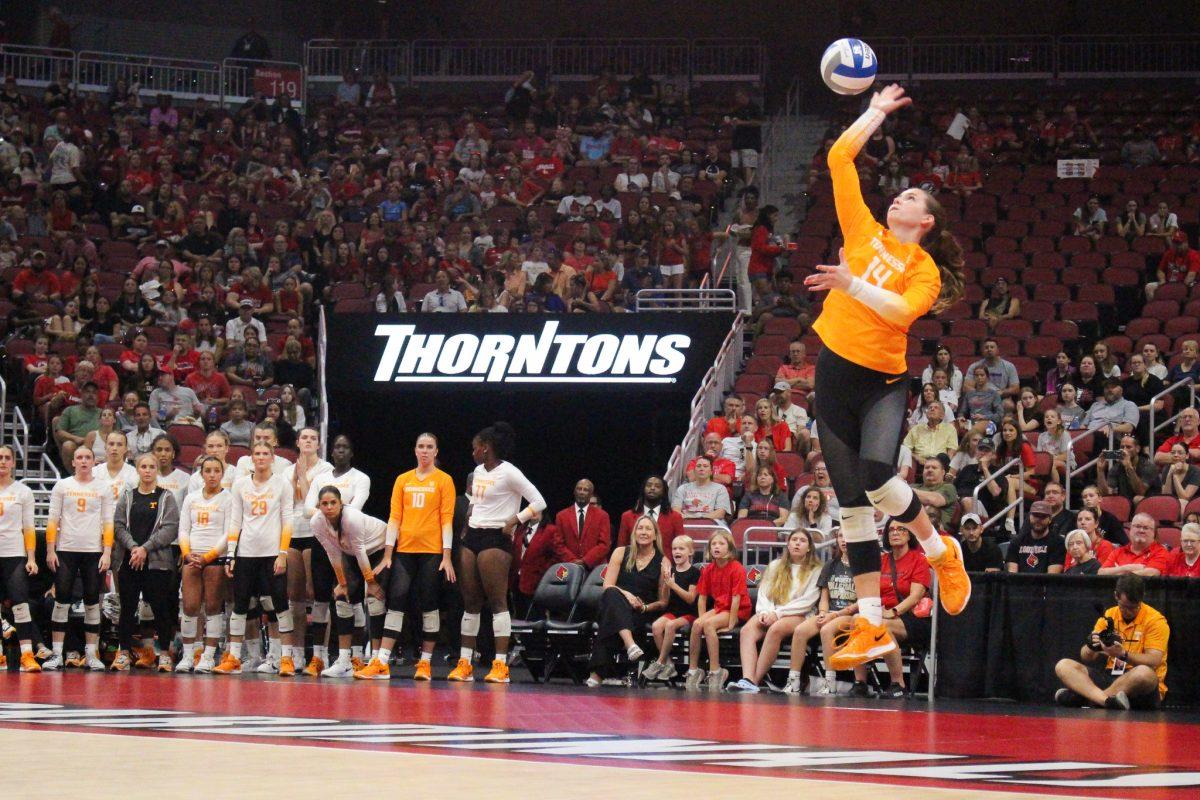 Sydney Jaynes (14) serves during a match against Louisville at the KFC Yum! Center. Sunday, Sept. 1, 2024.