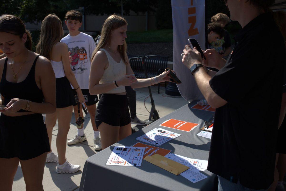 Students scan their personalized QR code through the Vol Connect App at the Student Engagement Fair. Aug. 23, 2024