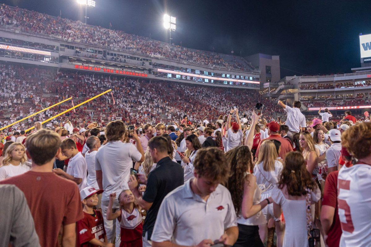 Fans storm the field after defeating Tennessee at Donald W. Reynolds Razorback Stadium. Saturday, Oct. 5, 2024. 