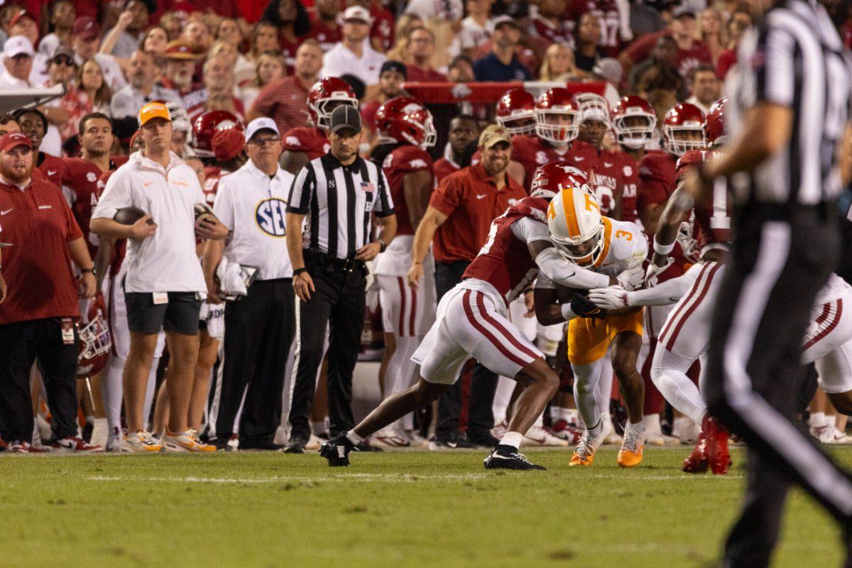 Squirrel White (3) is tackled by an Arkansas defender during a game at Donald W. Reynolds Razorback Stadium. Saturday, Oct. 5, 2024.