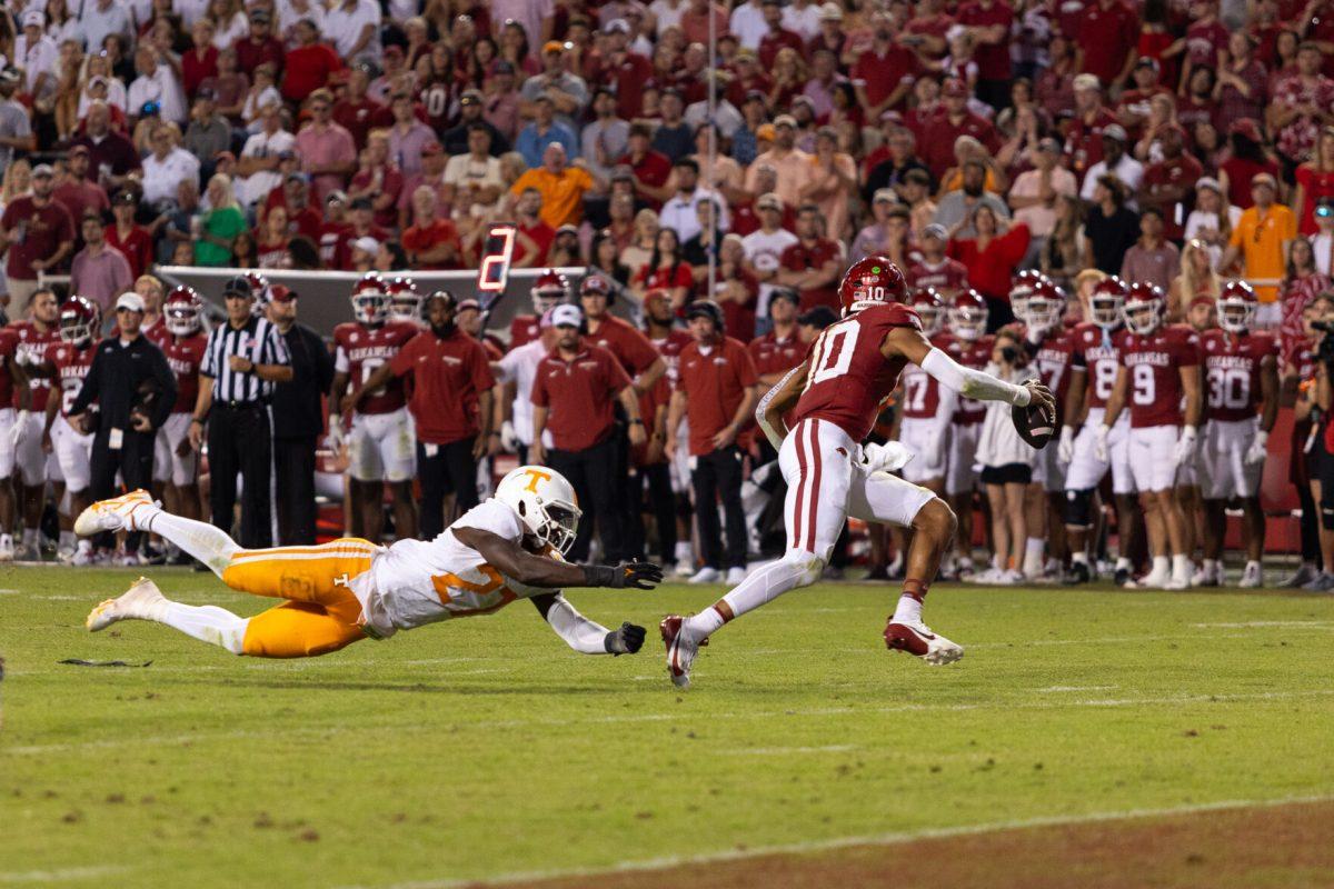 James Pearce Jr. (27) dives after the Arkansas quarterback during a game against Arkansas at Donald W. Reynolds Razorback Stadium. Saturday, Oct. 5, 2024. 